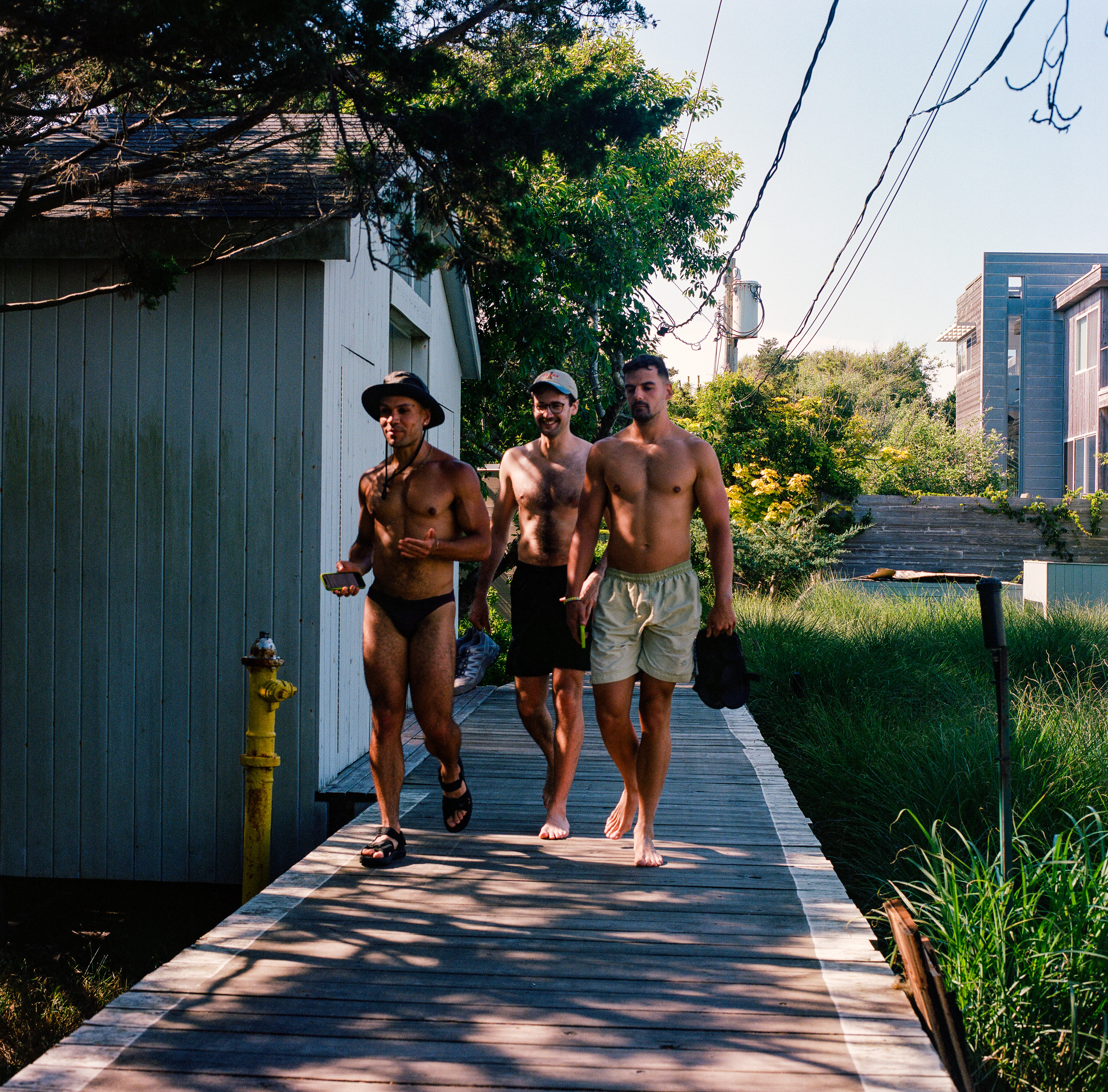 Fire Island 006, a square-format photograph street photograph made in Fire Island Pines, New York by Robert Andy Coombs.