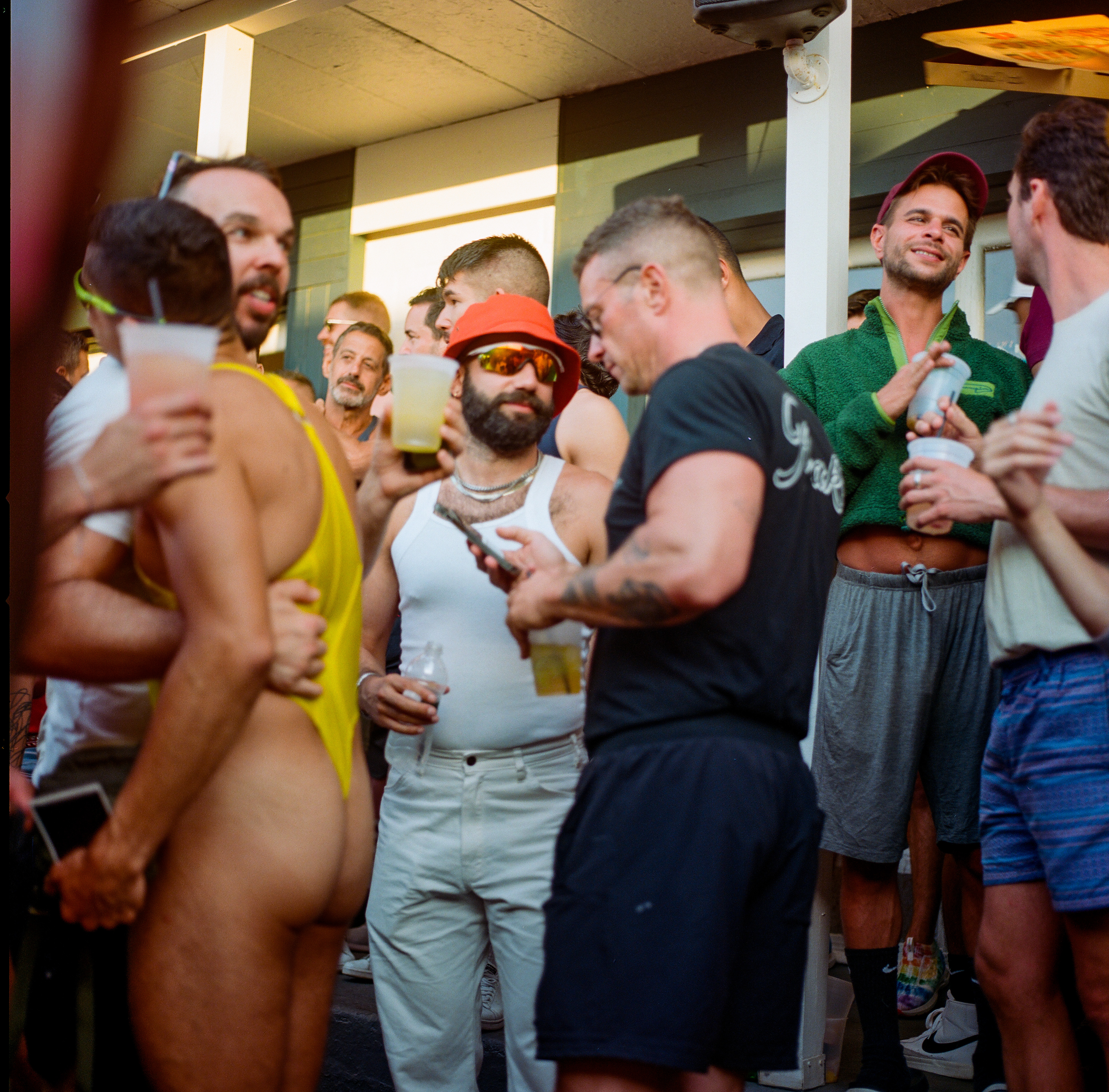 Fire Island 018, a square-format photograph street photograph made in Fire Island Pines, New York by Robert Andy Coombs.