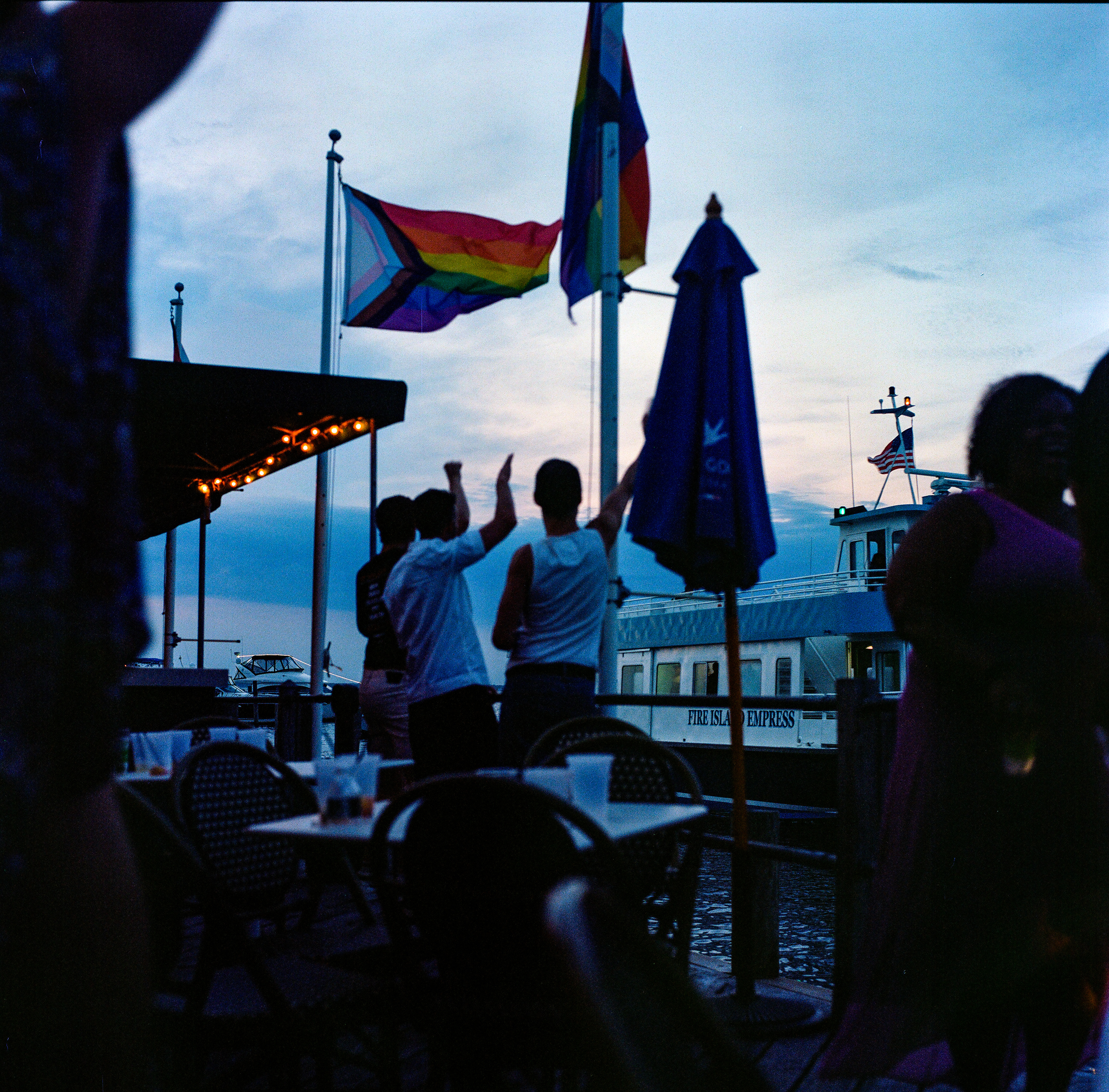 Fire Island 023, a square-format photograph street photograph made in Fire Island Pines, New York by Robert Andy Coombs.