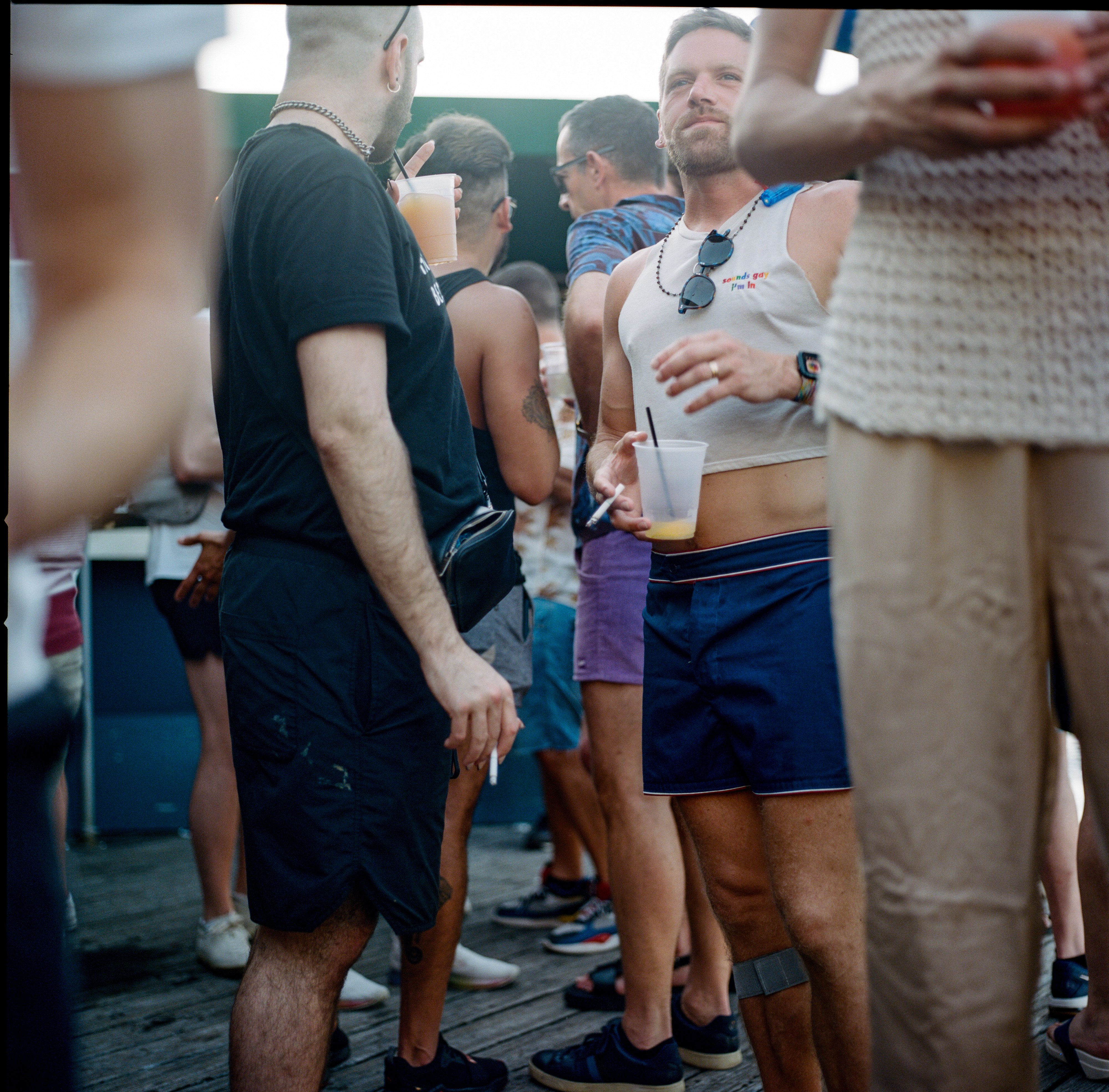 Fire Island 038, a square-format photograph street photograph made in Fire Island Pines, New York by Robert Andy Coombs.