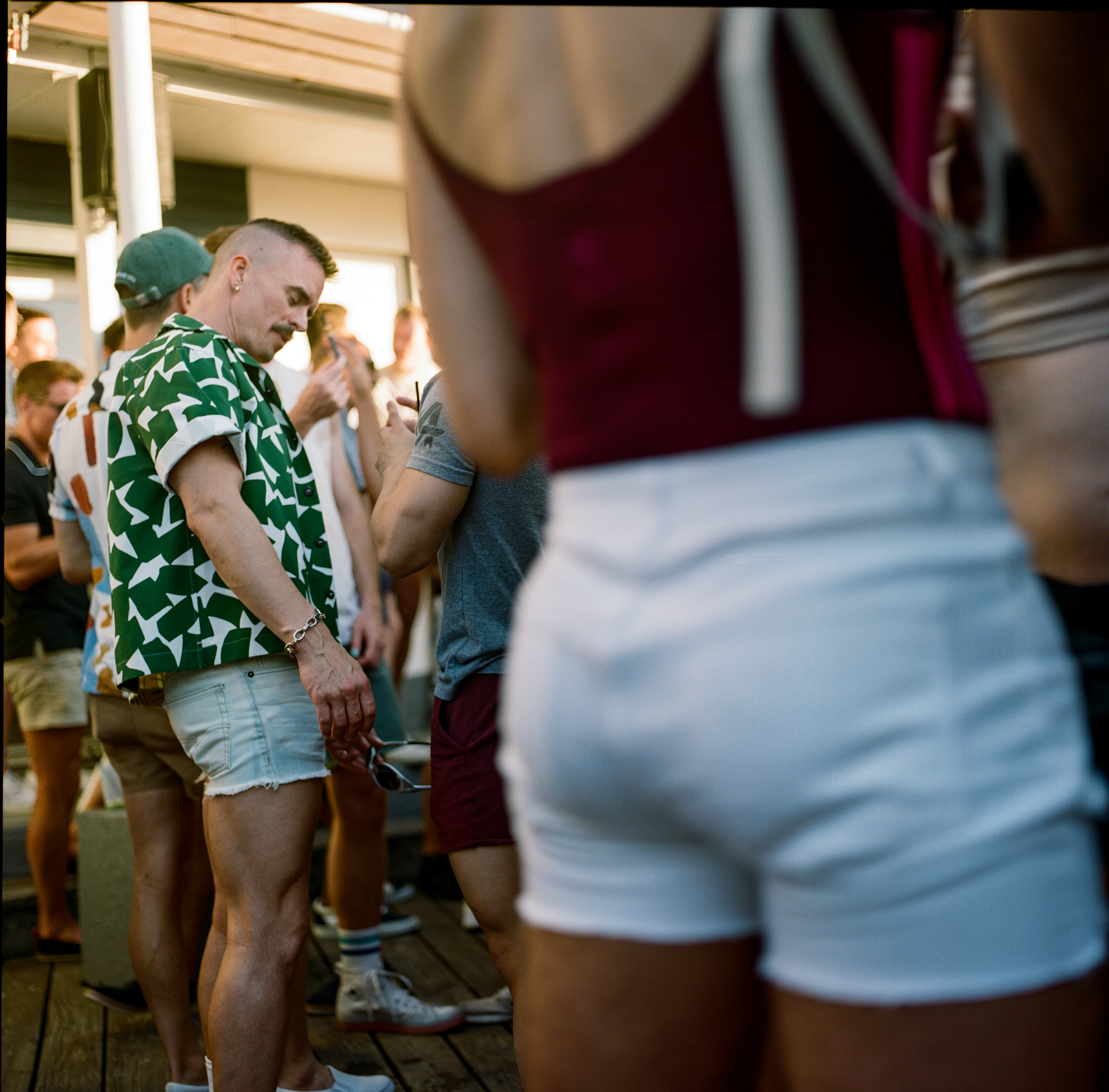 Fire Island 040, a square-format photograph street photograph made in Fire Island Pines, New York by Robert Andy Coombs.