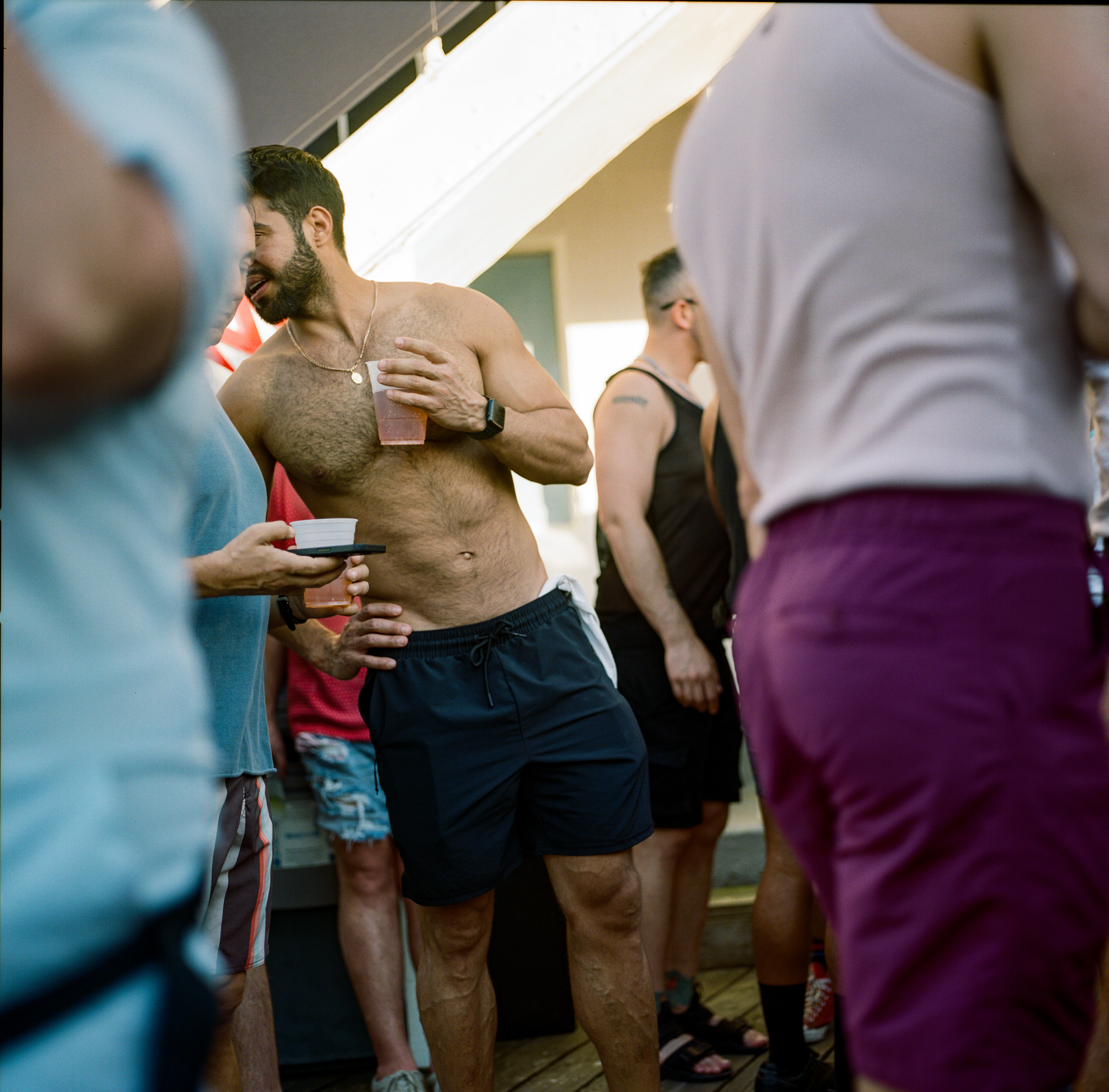 Fire Island 042, a square-format photograph street photograph made in Fire Island Pines, New York by Robert Andy Coombs.