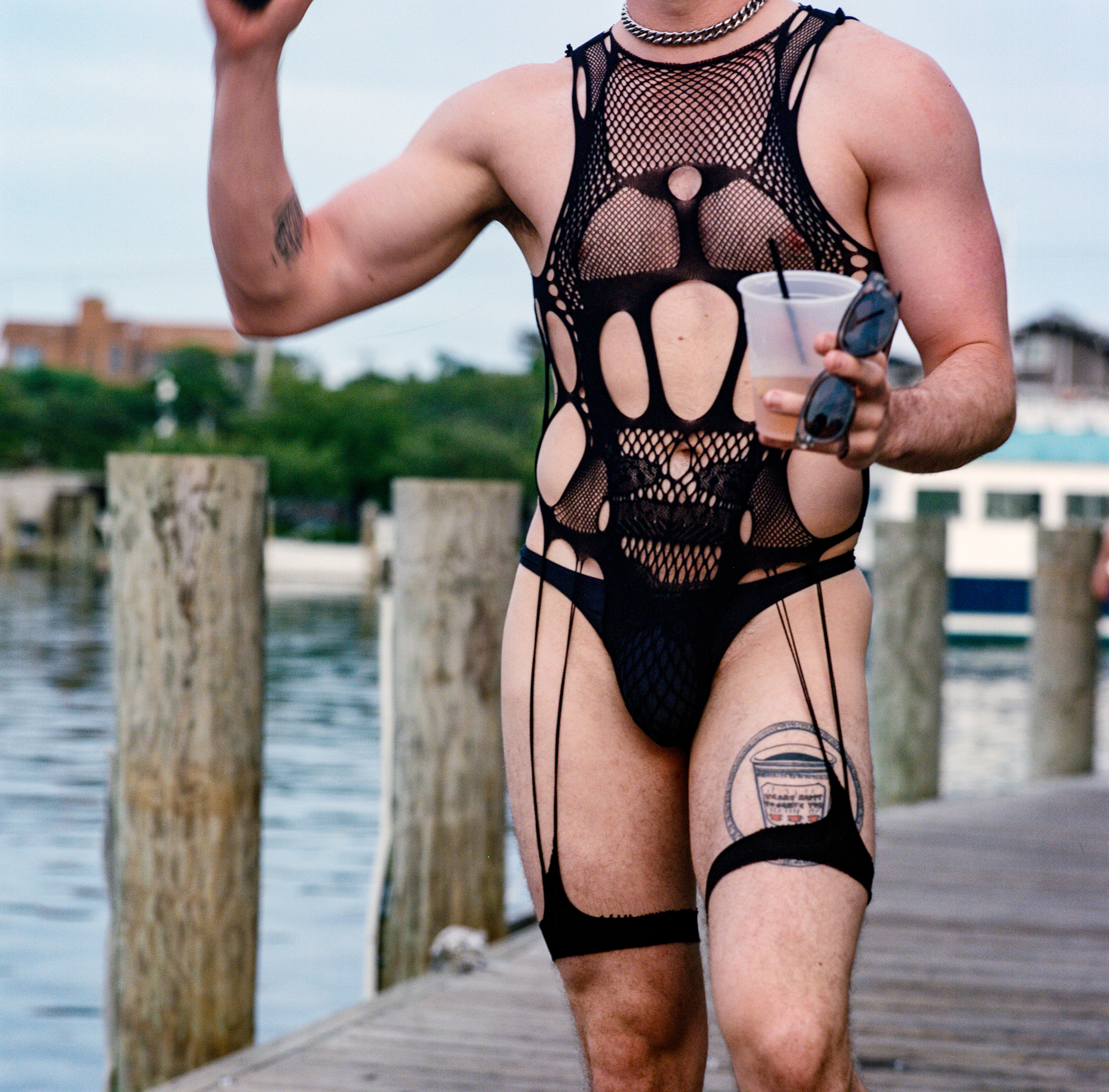 Fire Island 052, a square-format photograph street photograph made in Fire Island Pines, New York by Robert Andy Coombs.