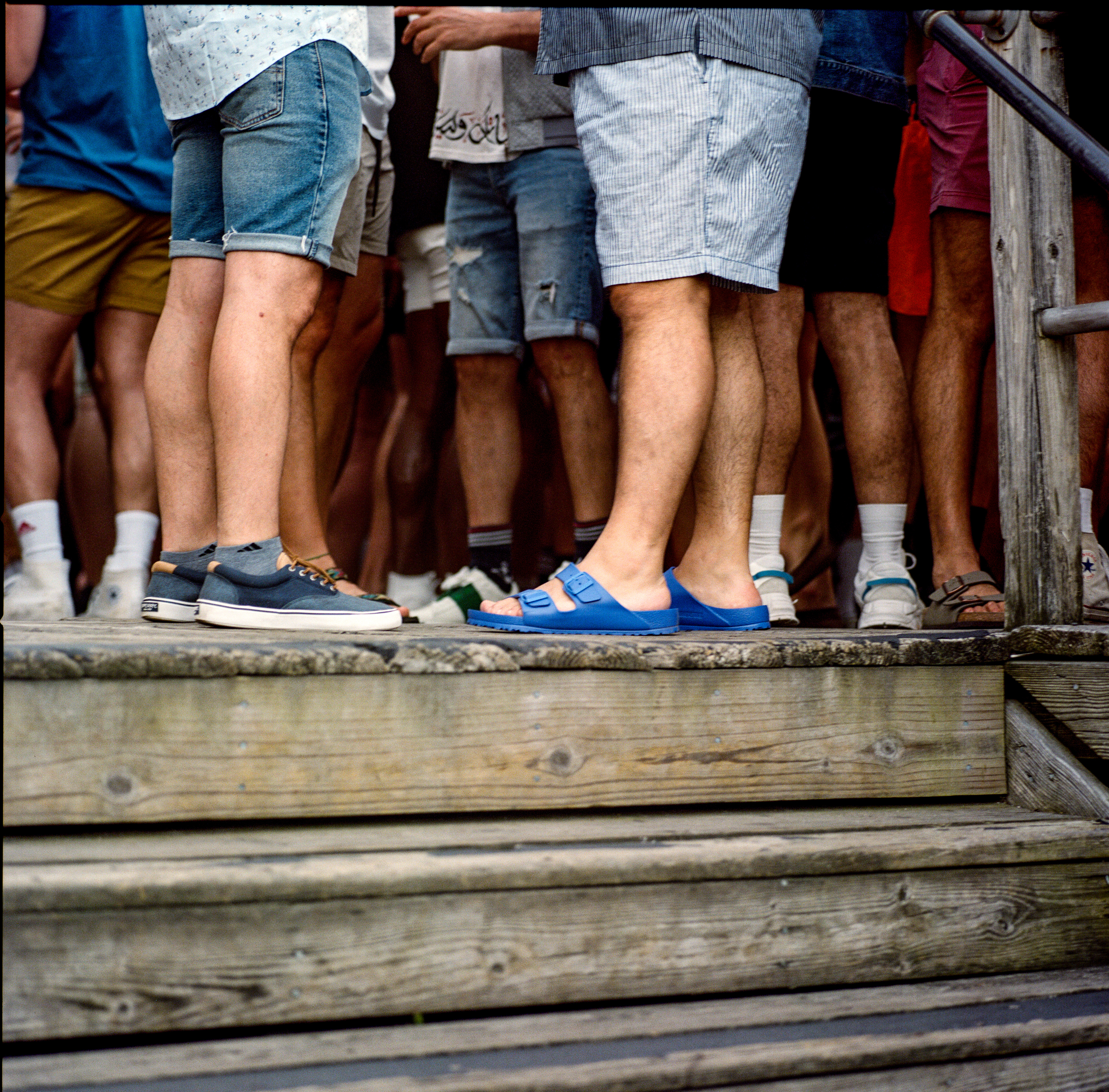Fire Island 054, a square-format photograph street photograph made in Fire Island Pines, New York by Robert Andy Coombs.