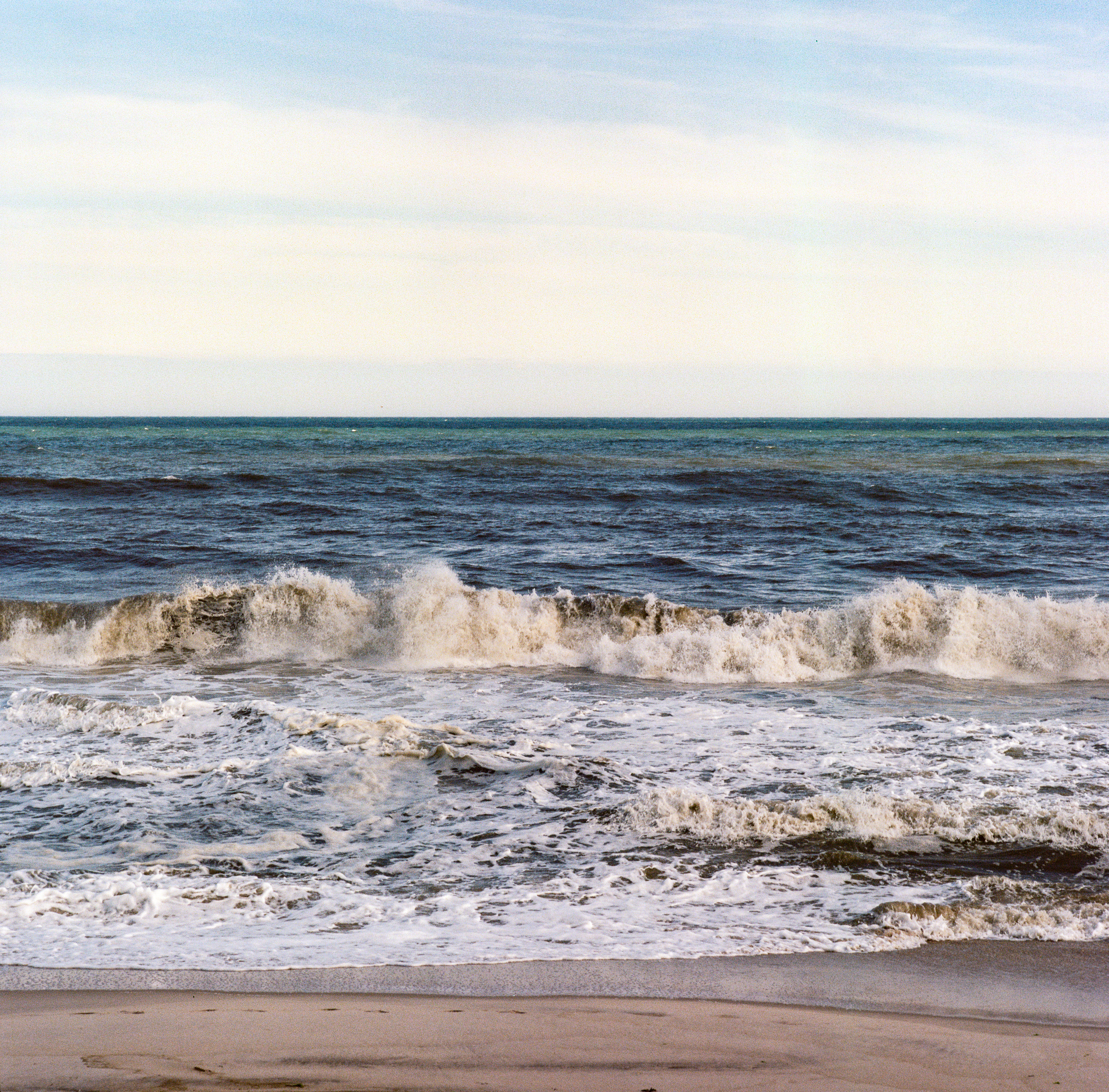 Fire Island 057, a square-format photograph street photograph made in Fire Island Pines, New York by Robert Andy Coombs.