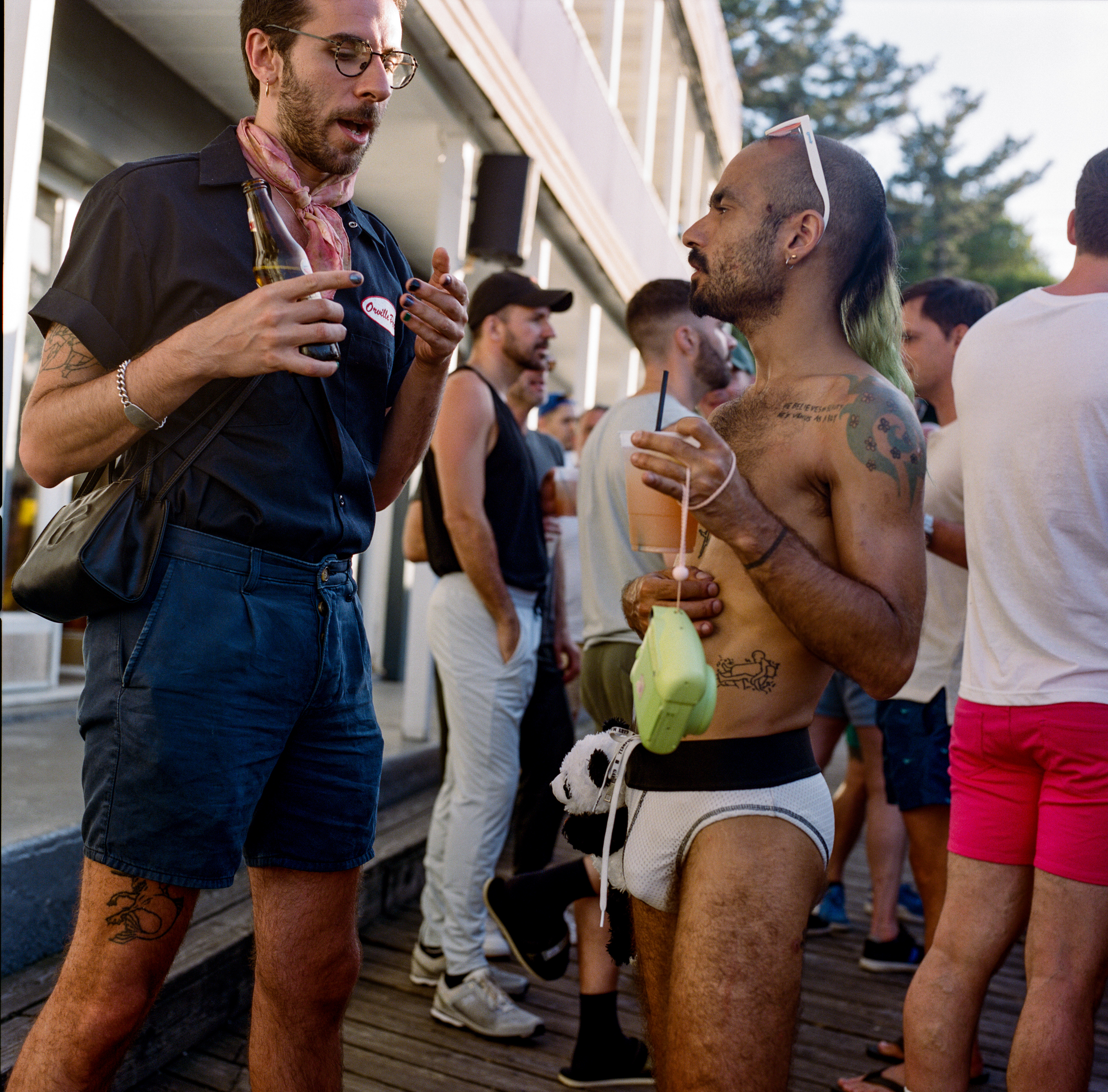 Fire Island 062, a square-format photograph street photograph made in Fire Island Pines, New York by Robert Andy Coombs.