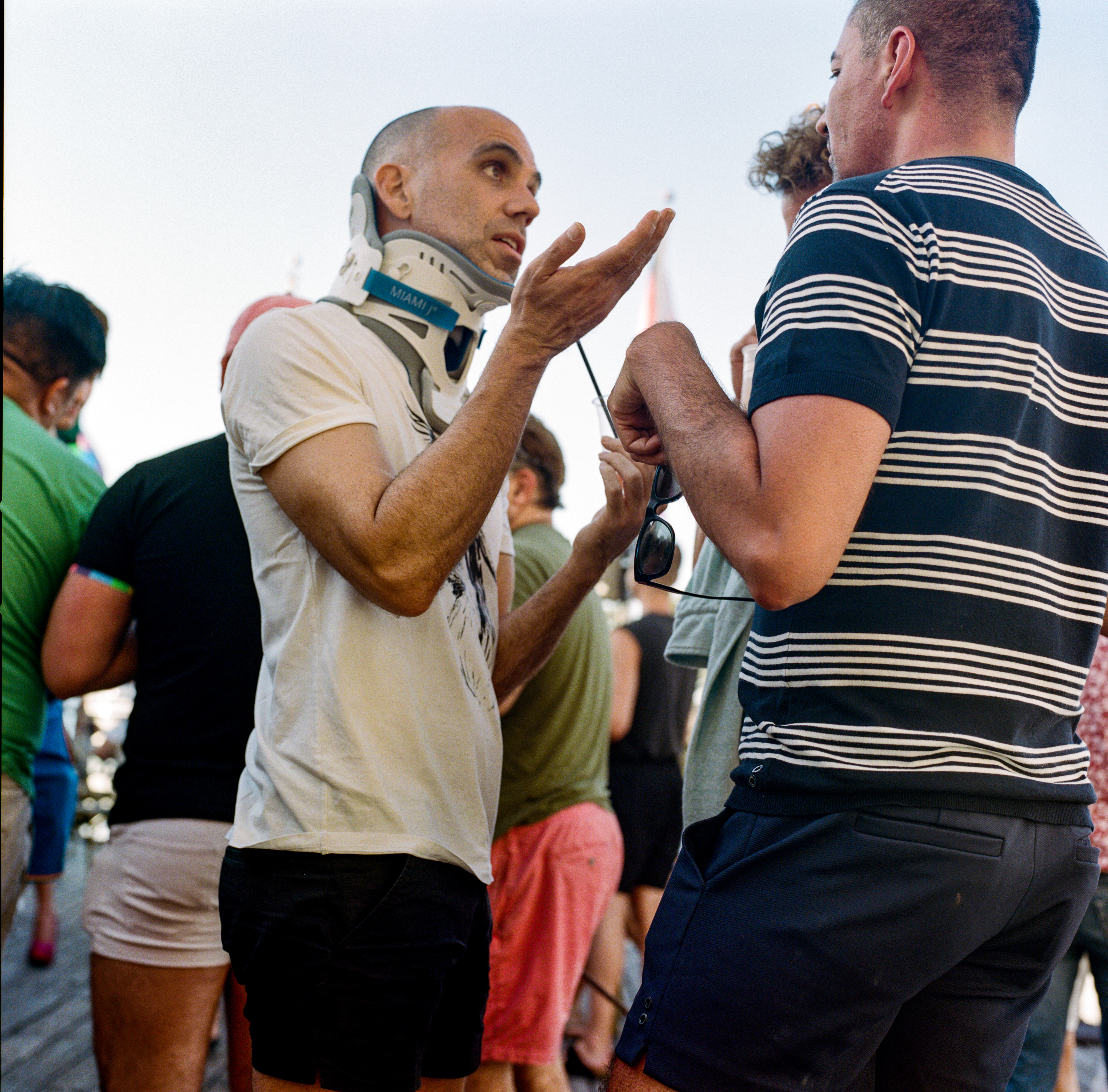 Fire Island 064, a square-format photograph street photograph made in Fire Island Pines, New York by Robert Andy Coombs.