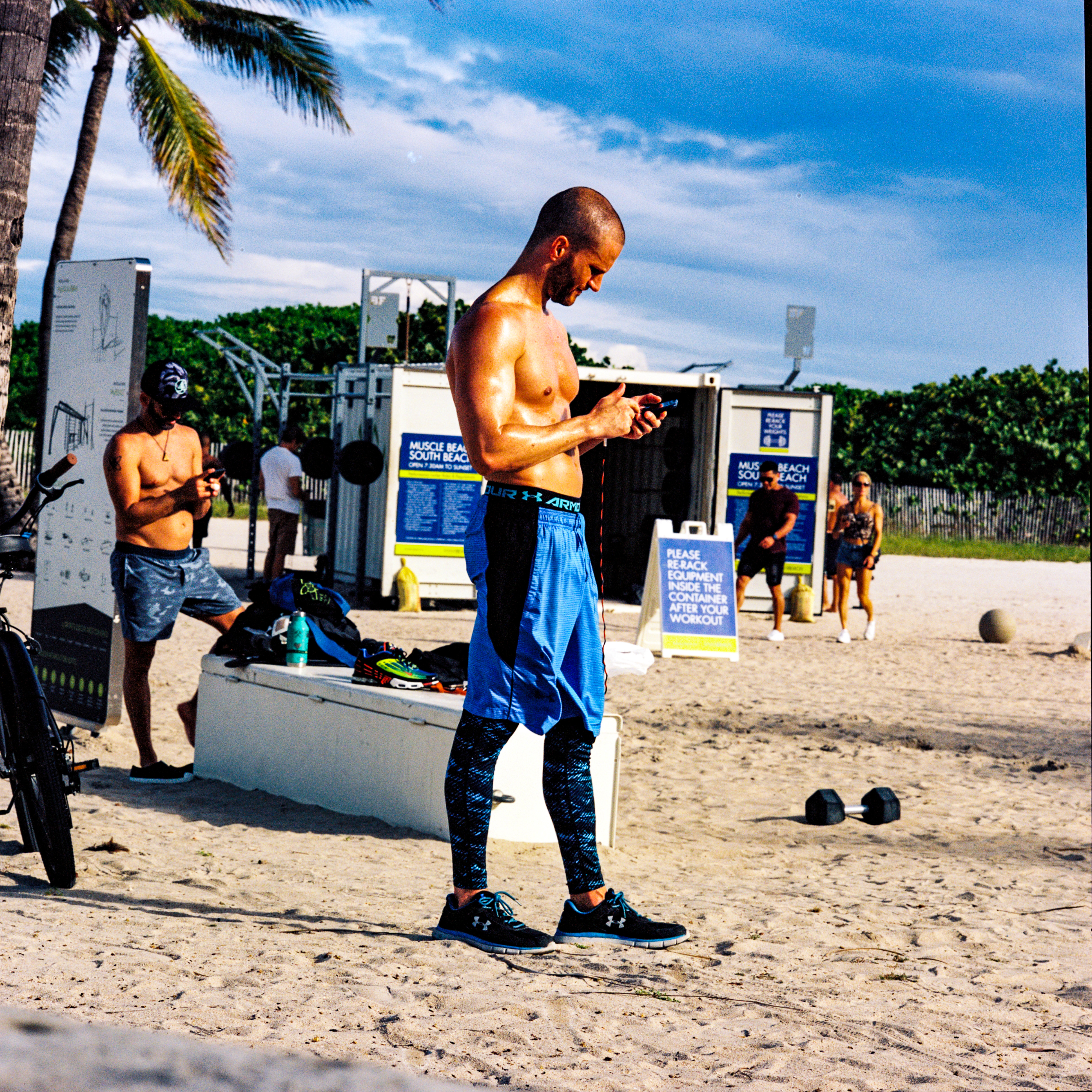 Miami Beach 035, a square-format photograph street photograph made in Miami Beach, Florida by Robert Andy Coombs.