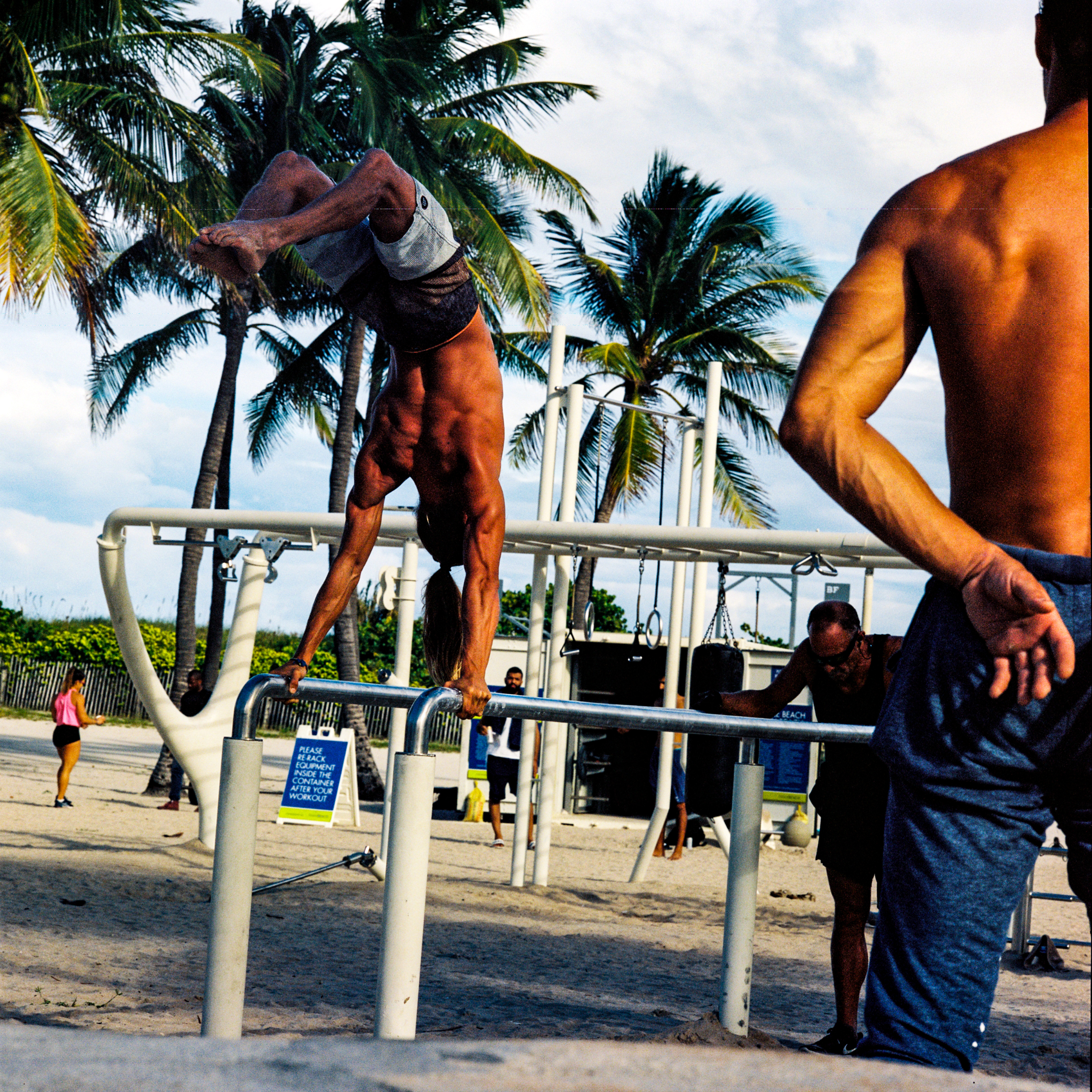 Miami Beach 040, a square-format photograph street photograph made in Miami Beach, Florida by Robert Andy Coombs.