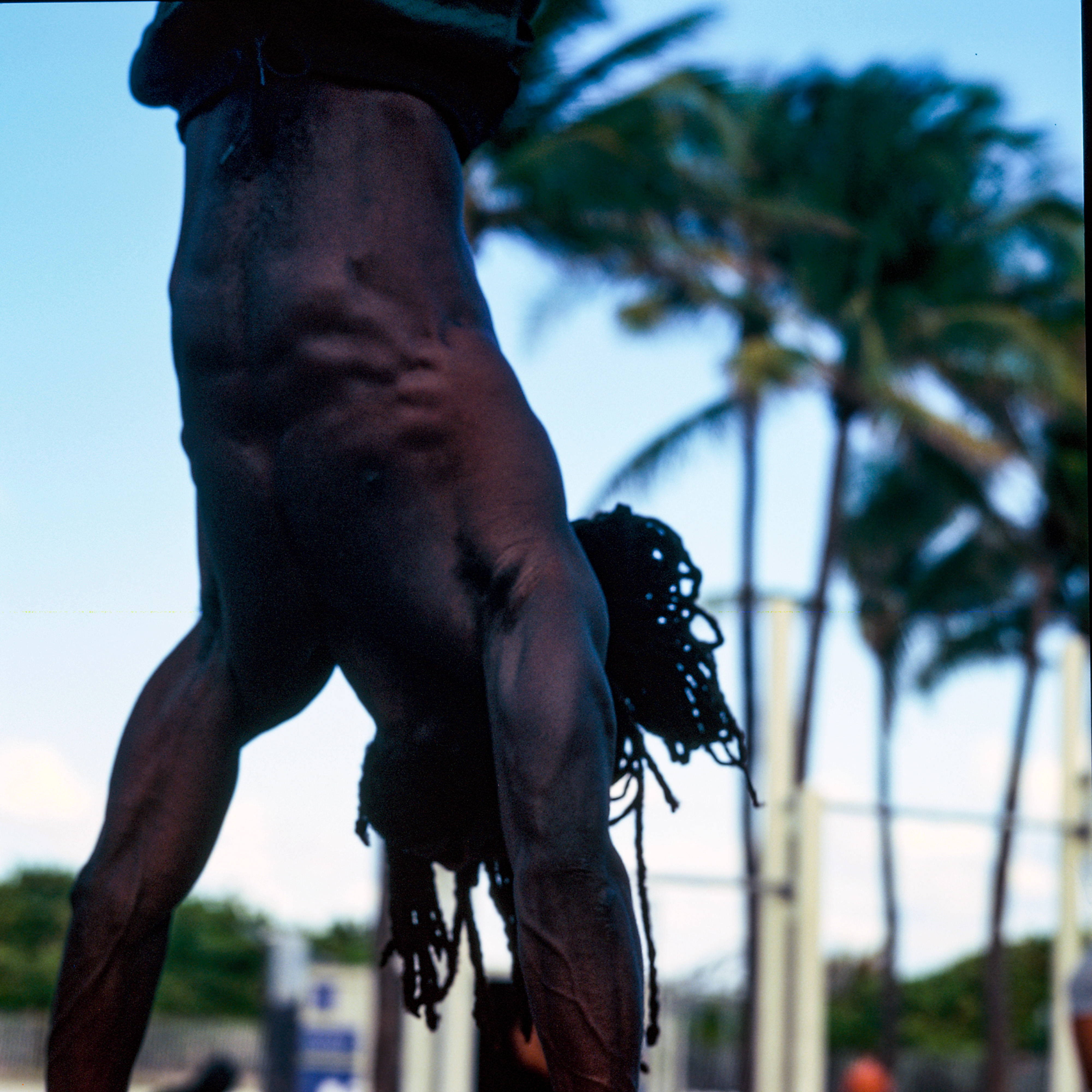Miami Beach 066, a square-format photograph street photograph made in Miami Beach, Florida by Robert Andy Coombs.