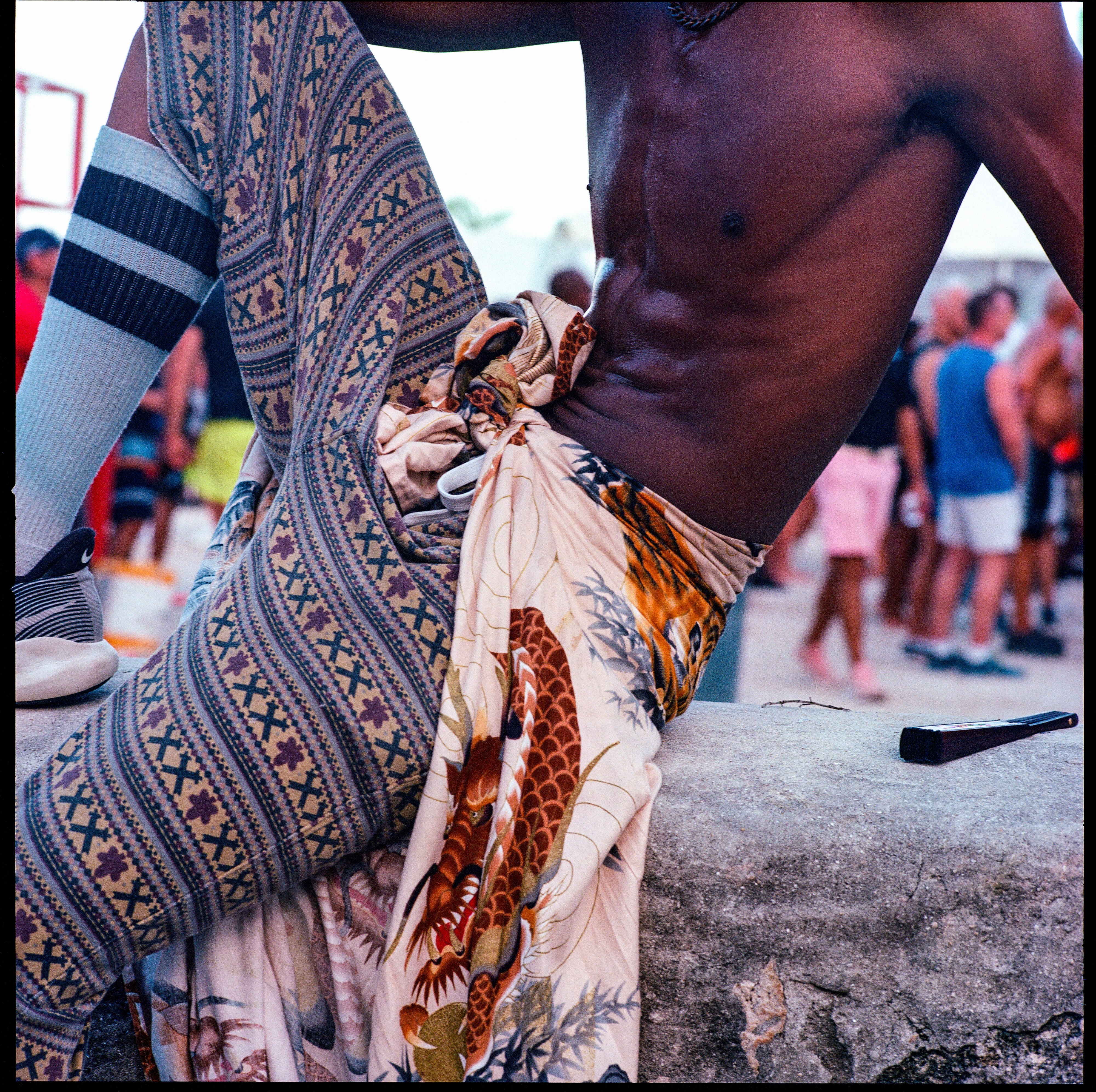Traversing Pride 110, a square-format photograph street photograph by Robert Andy Coombs.