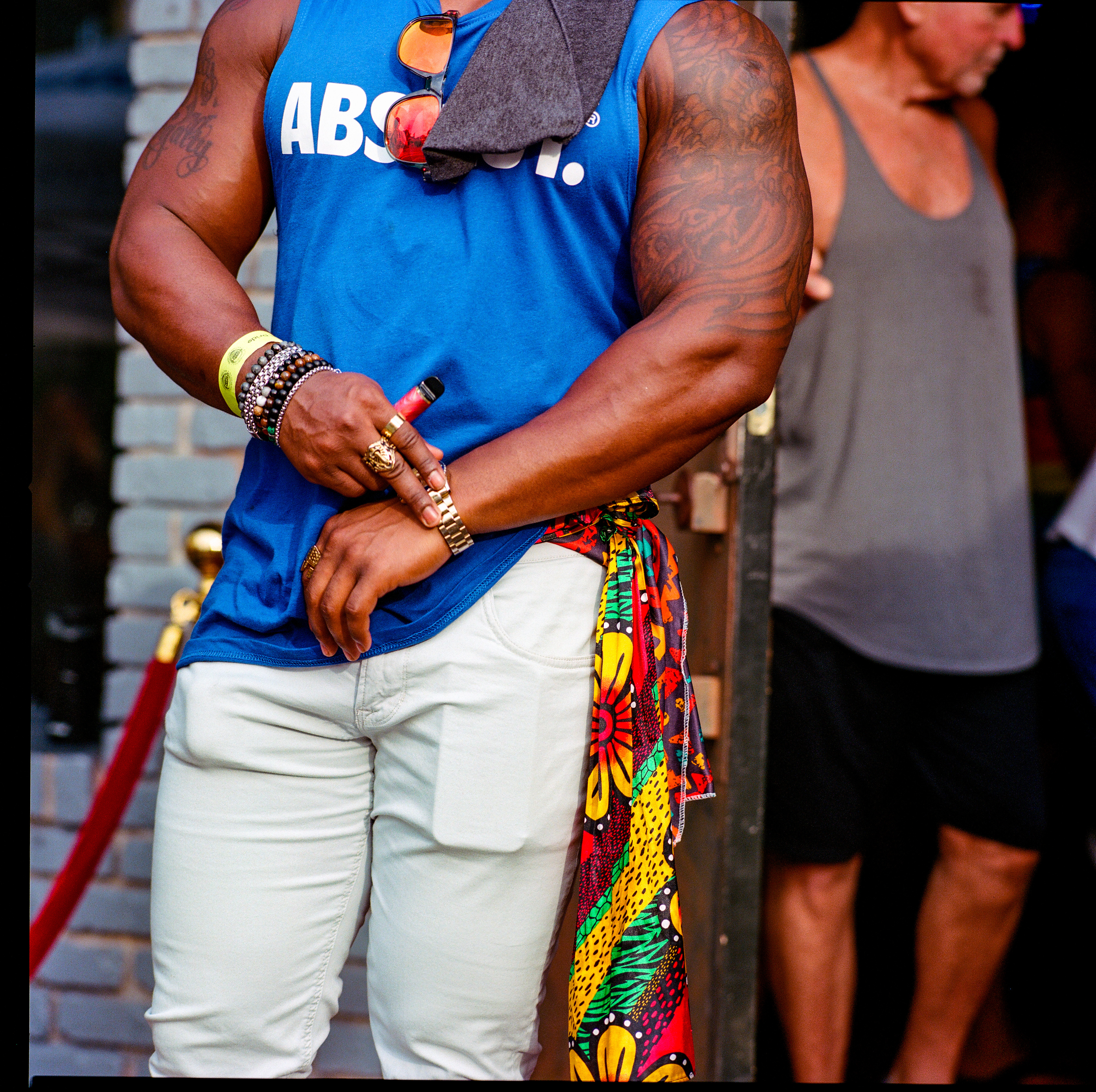 Traversing Pride 119, a square-format photograph street photograph by Robert Andy Coombs.