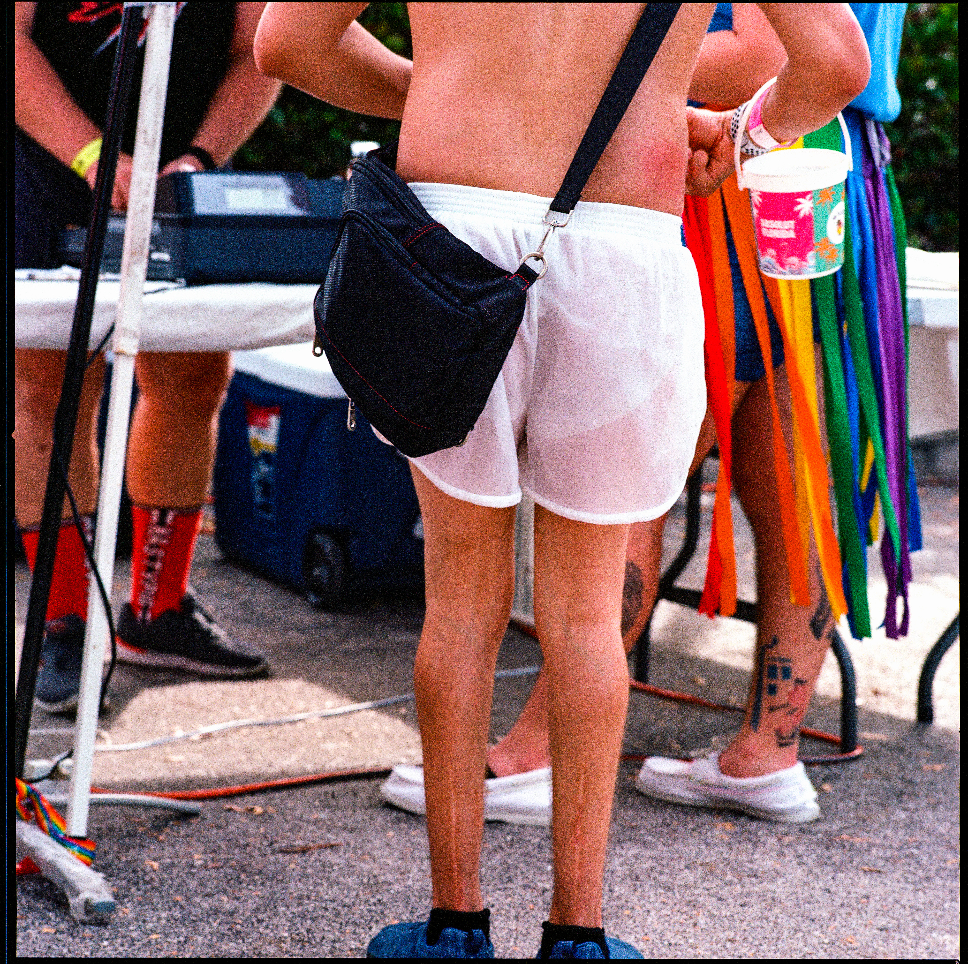Traversing Pride 129, a square-format photograph street photograph by Robert Andy Coombs.